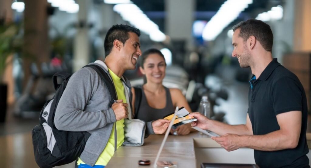 Having Conversation at the front desk in the gym